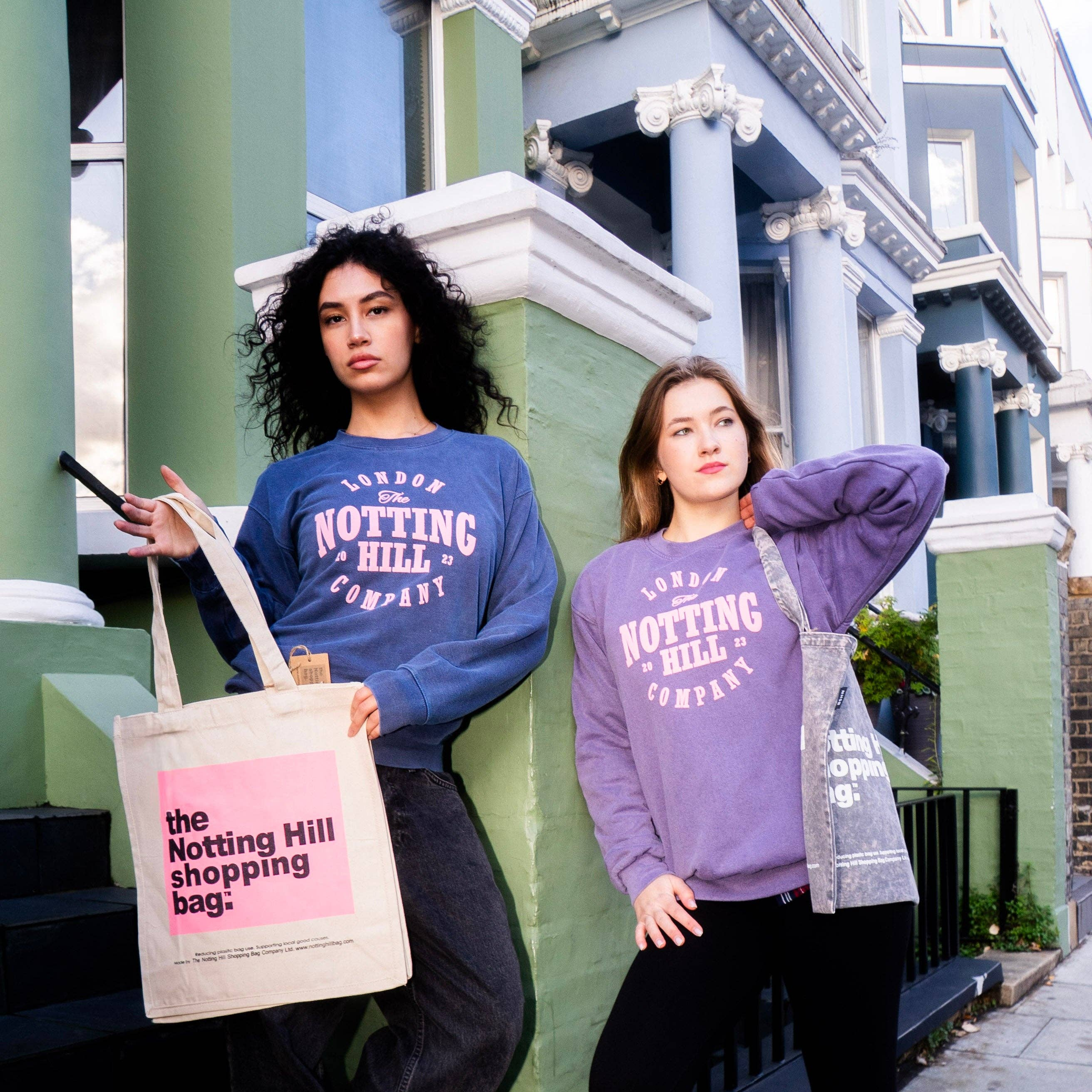 Girls holding Notting Hill Shopping Bags in London. the Colour BLock pink tote bag and the Basic Demin tote bag