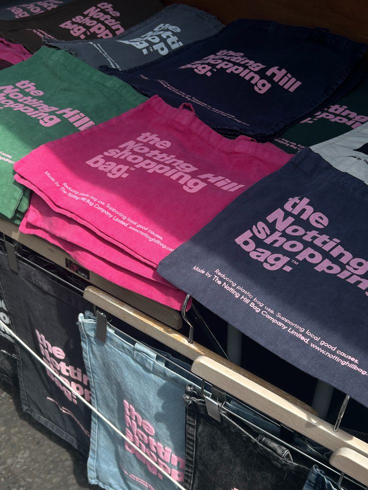 A collection of different colours of the Notting Hill Shopping Bag Hand dye collection, including pink, navy and green