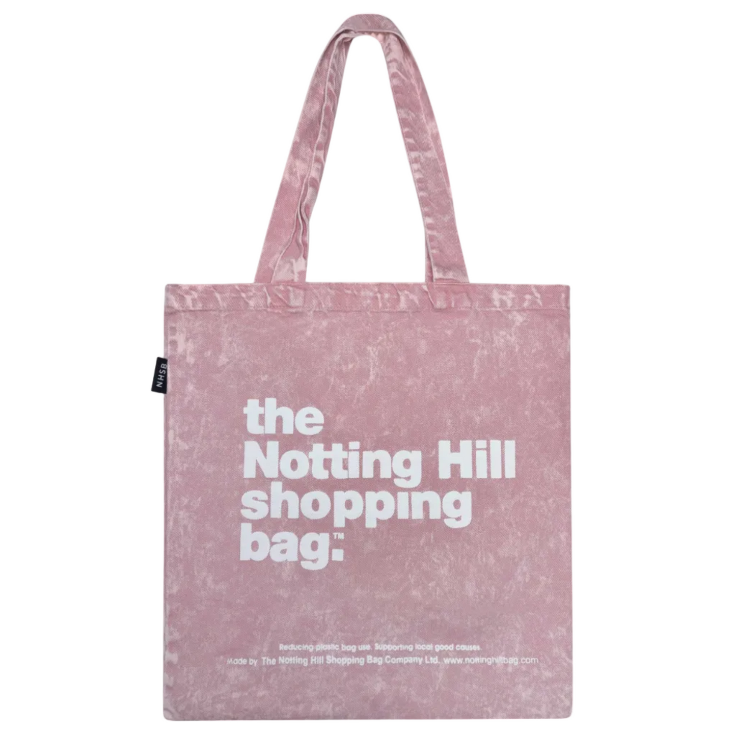 Pink tote bag with 'the Notting Hill shopping bag' text on a white background