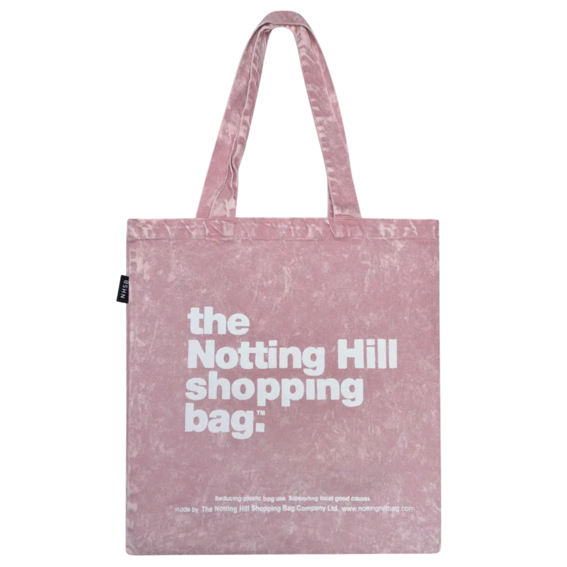 Pink tote bag with 'the Notting Hill shopping bag' text on a white background